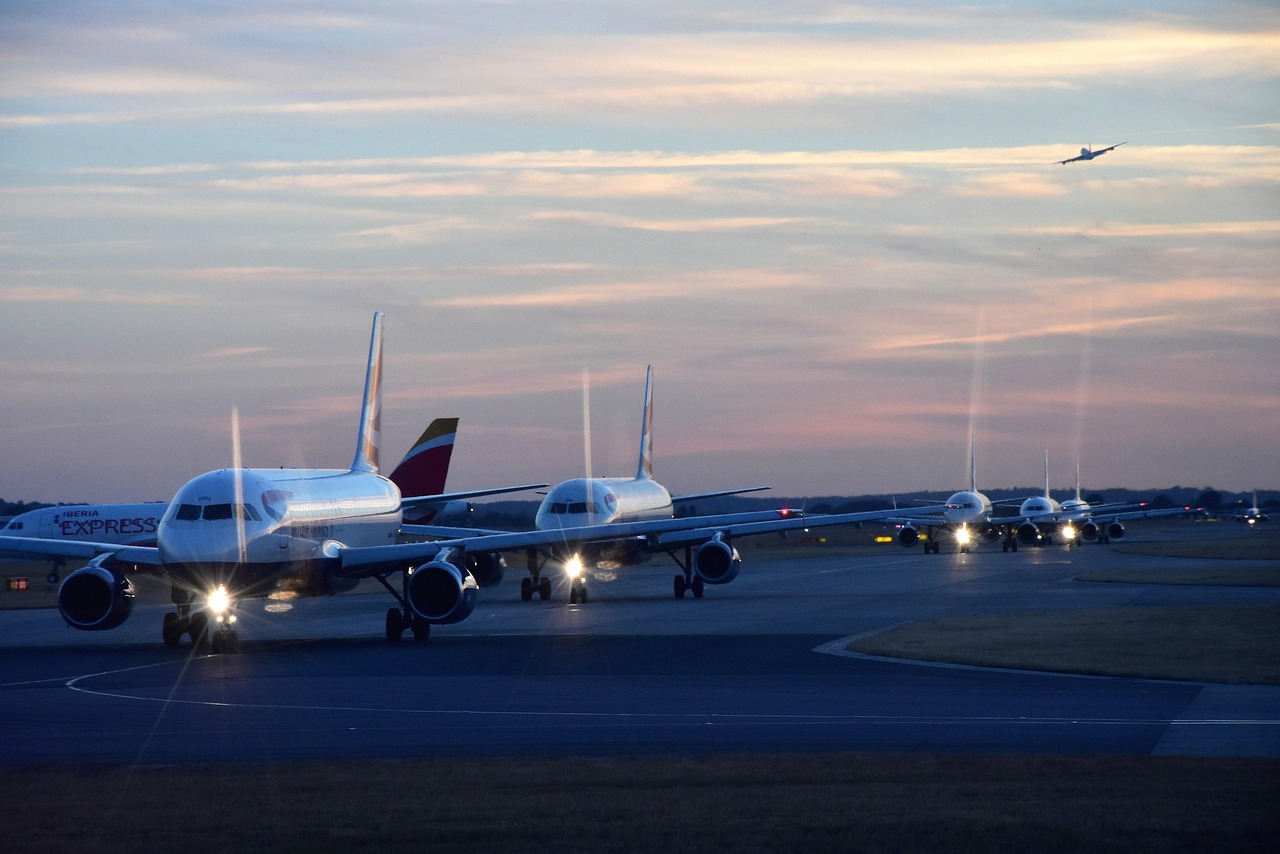 Canada eTA for UK Citizens: Cost, Requirements and How to Apply: passenger aircraft on the airport apron at dusk
