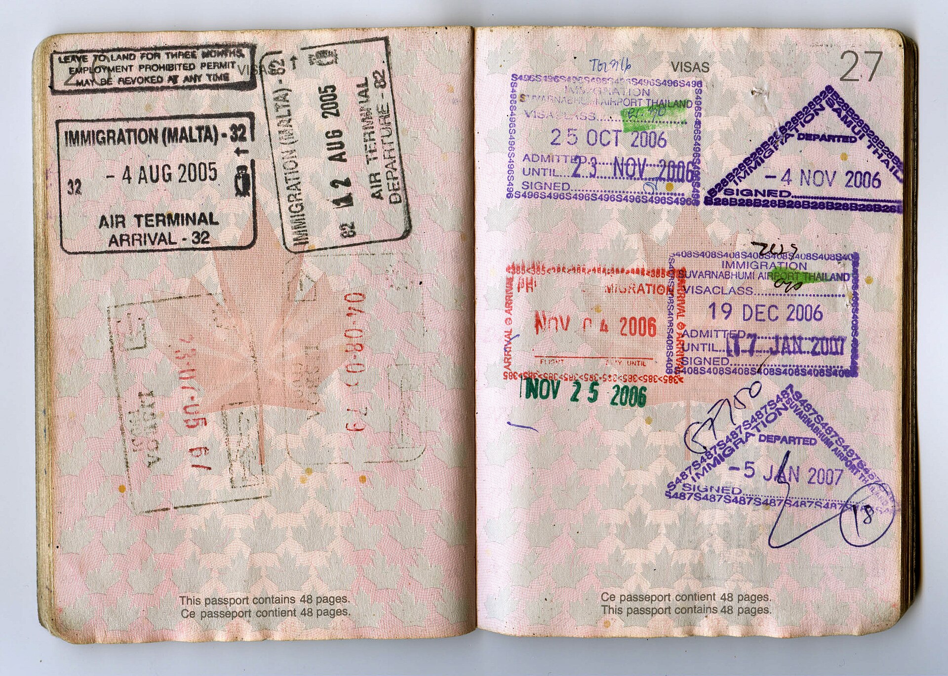 Canada eTA passport country code: open Canadian passport pages with entry and exit stamps